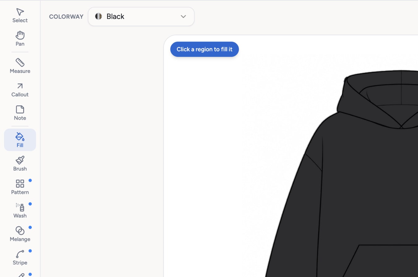 The canvas tool rail with the Fill tool selected, the colorway set to Black and the prompt Click a region to fill it over the hoodie sketch